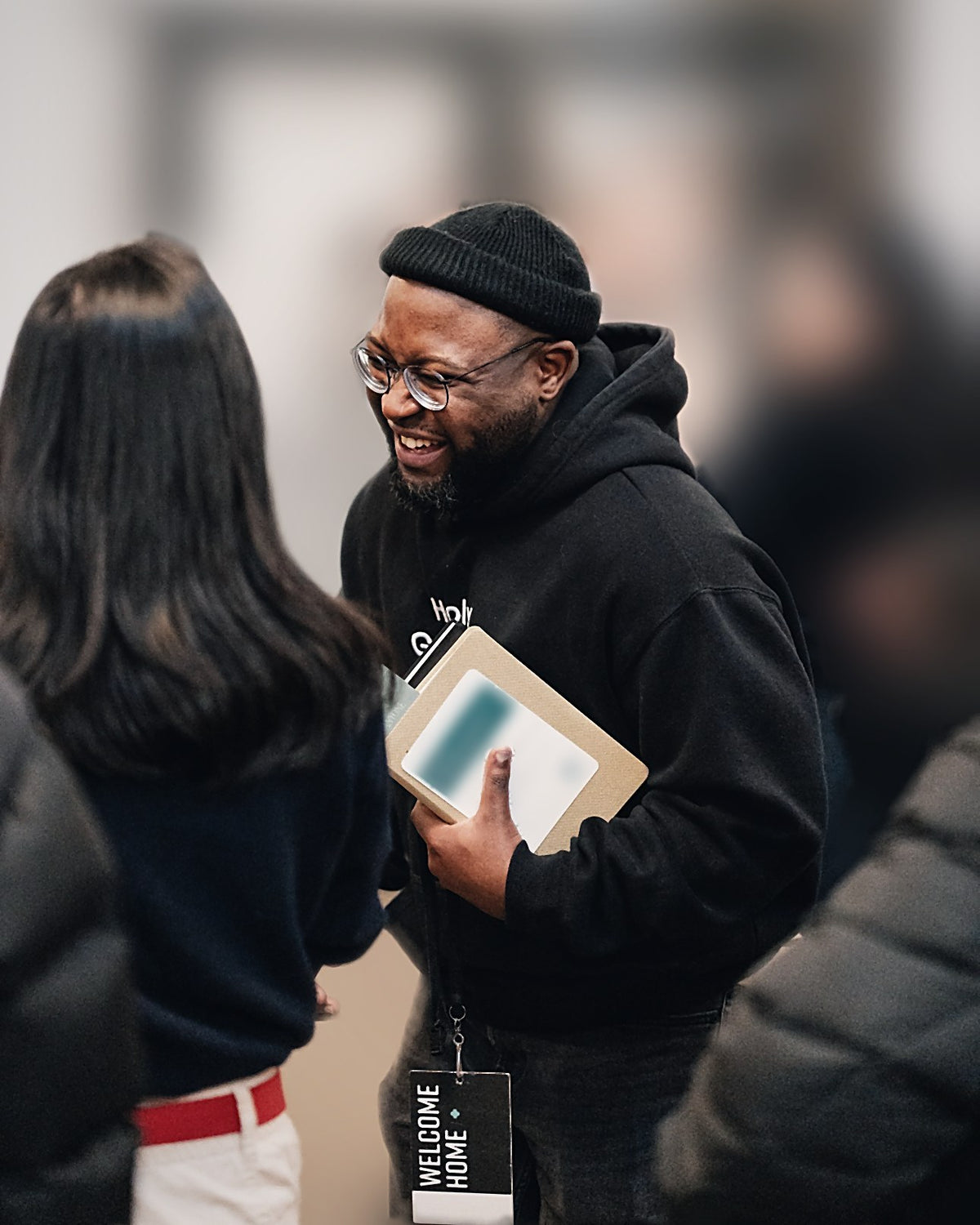 Wearing the Holy Ground hoodie at a church welcome event